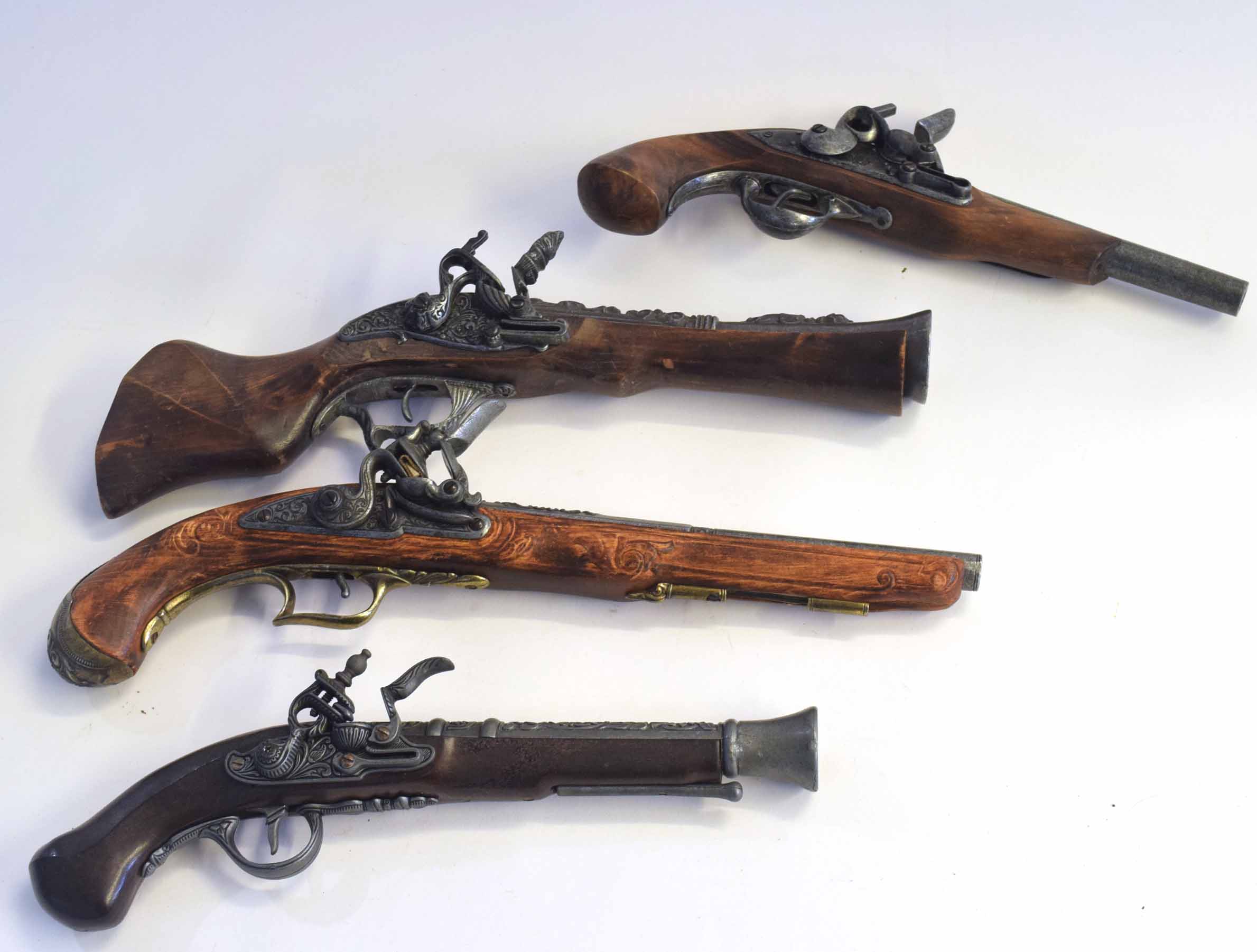 Four replica prop flintlock pistols