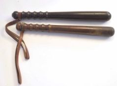 Pair of wooden 20th century Police truncheons/night-sticks, (2)