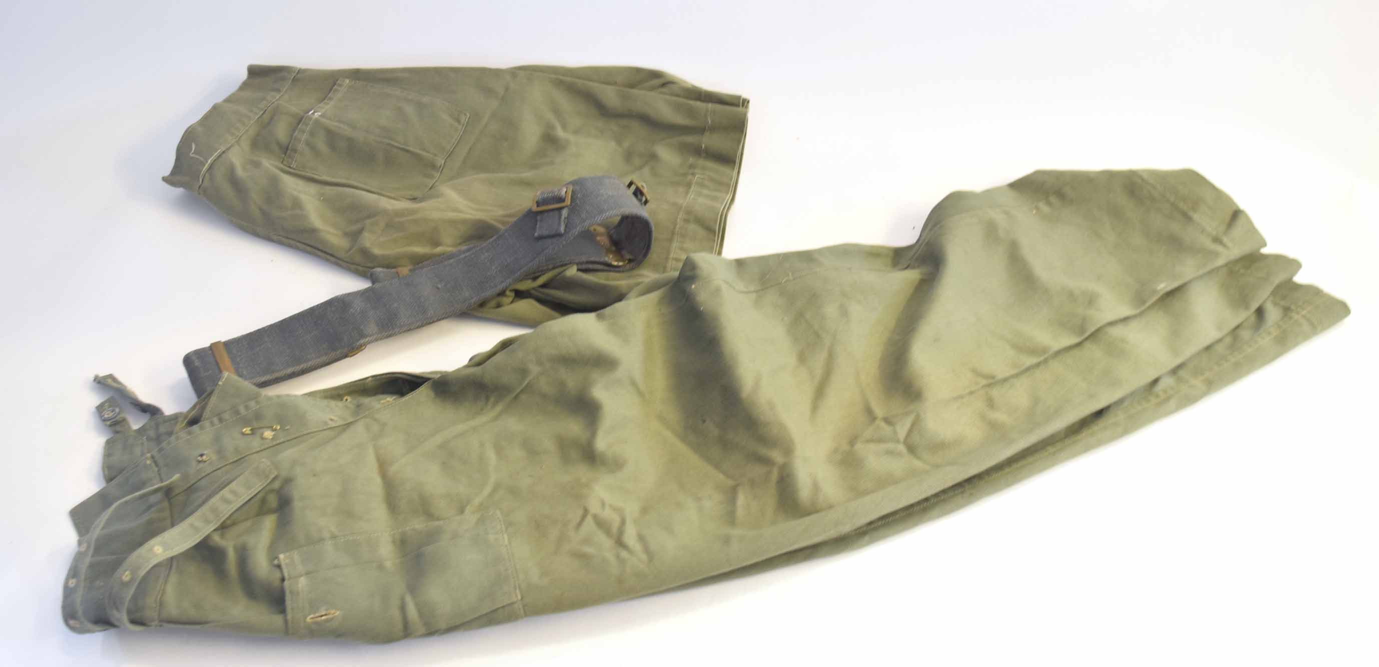 Two post-war jungle green trousers and shorts, together with 1963 dated RAF, 1937 pattern, belt