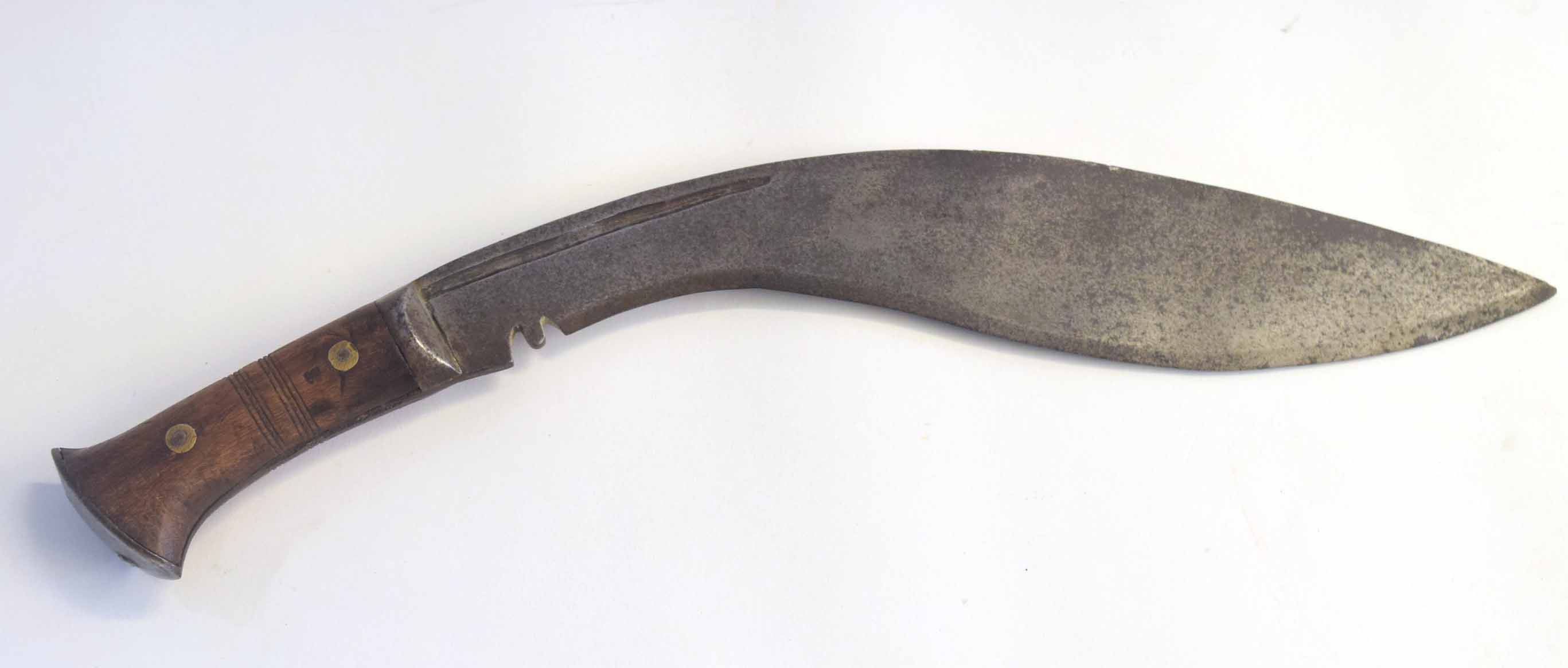 20th century Nepalese Kukri knife with hardwood handles and flat metal pommel stamped "J N B 43"