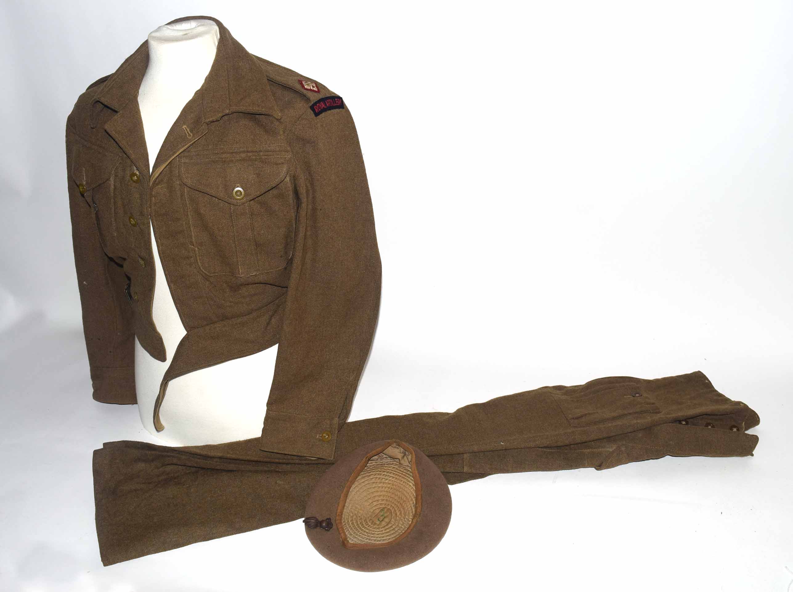 Set of 1946 dated size 9 1940 pattern battle dress trousers and jacket, with badges for a 2nd Lt