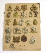 Quantity of assorted cap badges, various ages, crowns and manufacturers to include 22nd Dragoons,