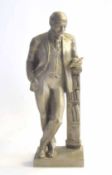 Mid-20th century aluminium bust of communist leader Vladimir Lenin leaning on a book case, approx