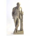 Mid-20th century aluminium bust of communist leader Vladimir Lenin leaning on a book case, approx