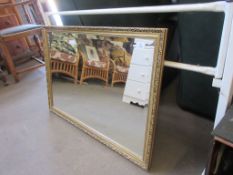 MODERN GILT BEVELLED WALL MIRROR, 83CM WIDE