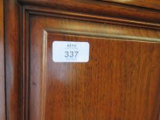 VERY LARGE THREE DOOR WARDROBE WITH CENTRAL MIRRORED PANEL AND BRASS HANDLES WITH BADGE W & R