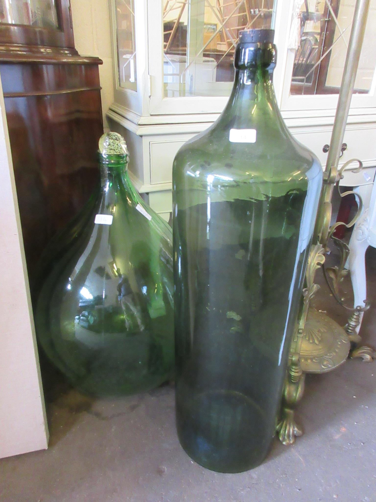 TWO VERY LARGE GREEN GLASS VASES, LARGEST 86CM HIGH