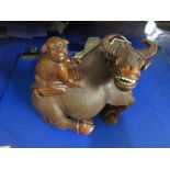 WOODEN FIGURE OF MYTHOLOGICAL BULL WITH RIDER