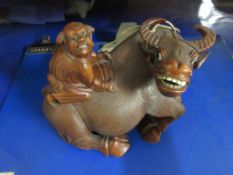 WOODEN FIGURE OF MYTHOLOGICAL BULL WITH RIDER