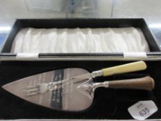 CASE CONTAINING SILVER PLATED TROWEL AND FORK, THE TROWEL ENGRAVED “PRESENTED TO R W BRO HOWARD G