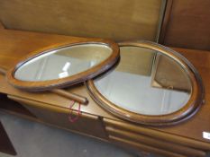 TWO OVAL WALL MIRRORS