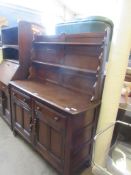 POSSIBLY LATER ERCOL FOUR DRAWER SIDE UNIT, 121CM WIDE