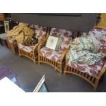 SET OF FOUR MODERN CANE CONSERVATORY ARMCHAIRS, UPHOLSTERED IN CREAM AND RED FLORAL DESIGN, 74CM