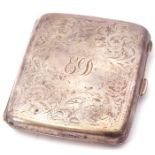 George V silver cigarette case of shaped rectangular form with central monogram, chased and engraved