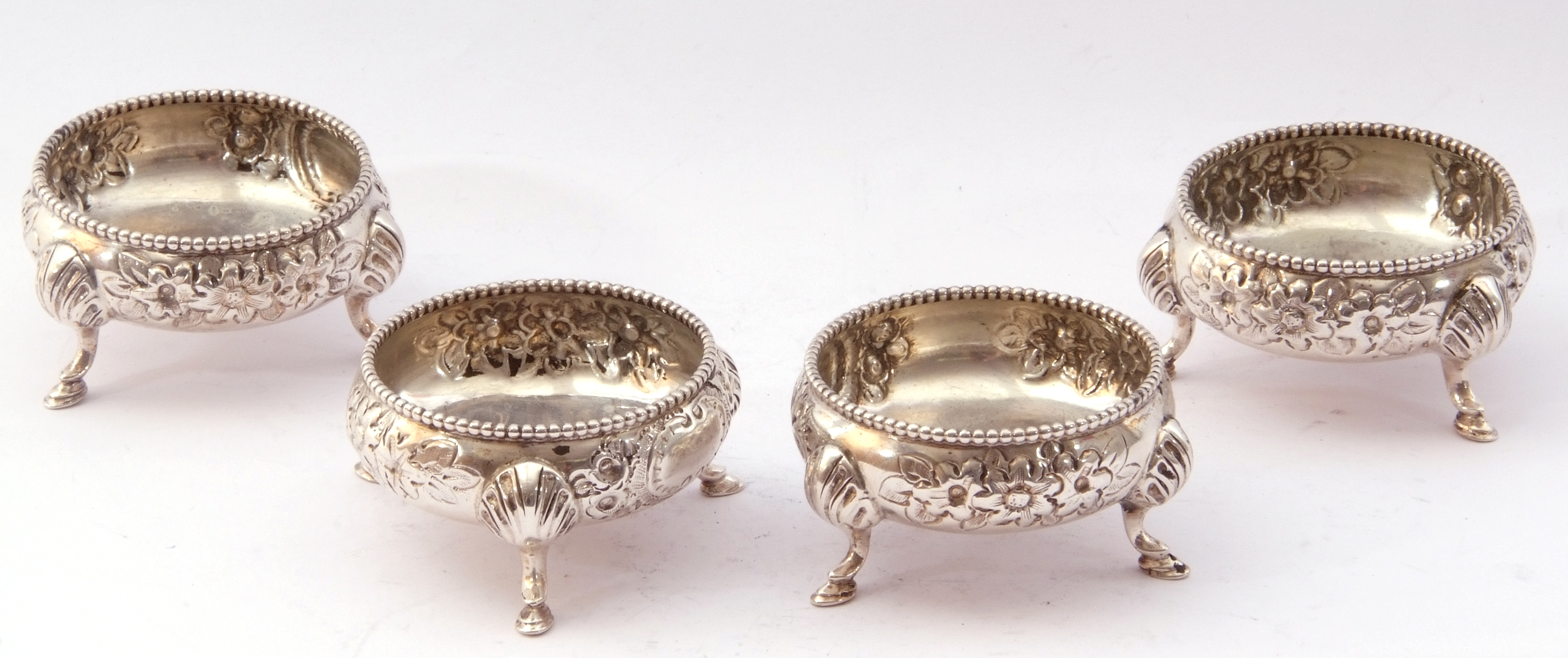 Late Victorian set of four cauldron salts each with gadrooned rims, foliate repousse decoration on - Image 3 of 4