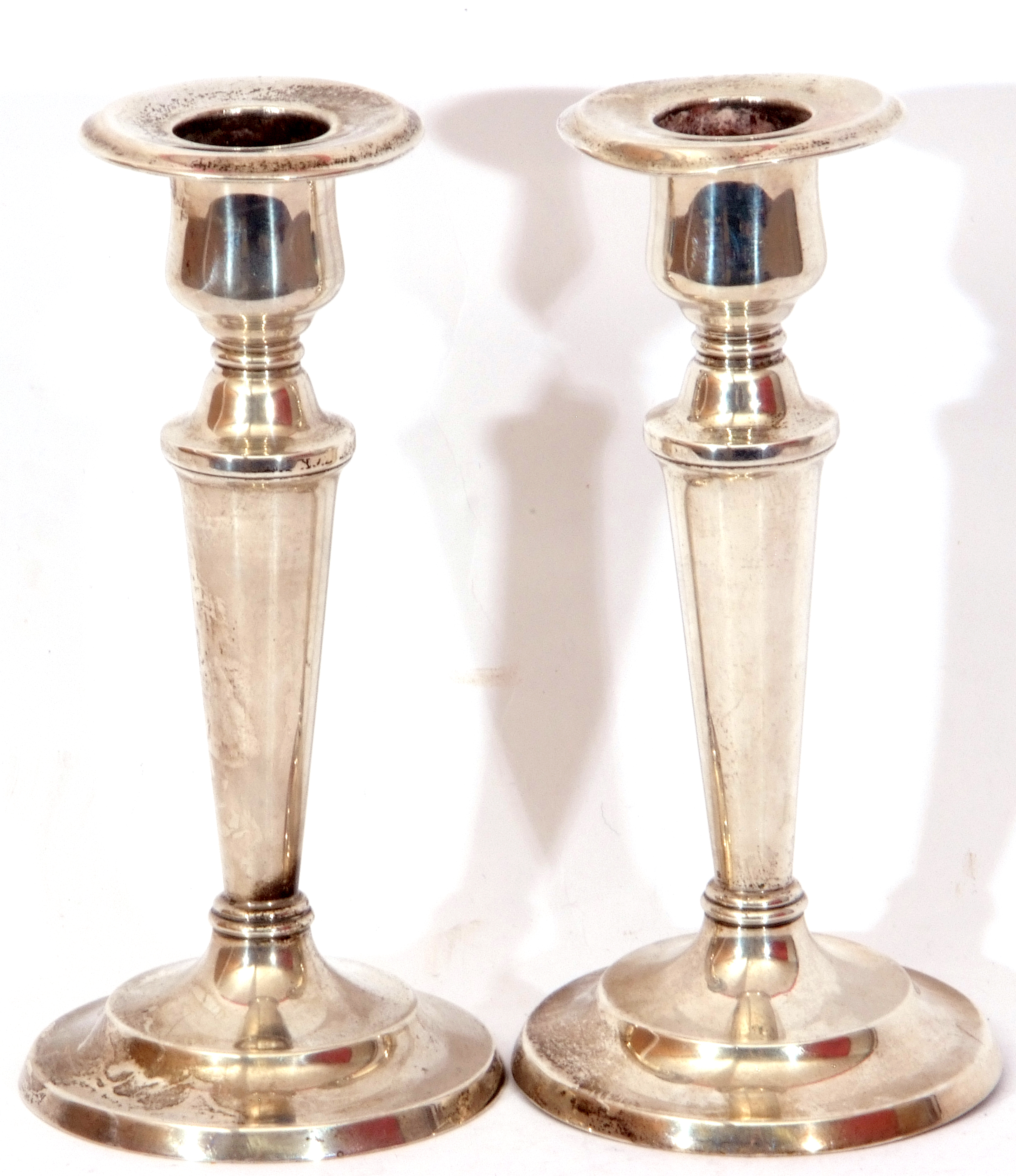 Pair of loaded "Sterling" candlesticks, baluster form, raised on spread loaded bases, Birmingham