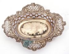 Early 20th Century silver bon-bon dish of shaped oval design, pierced and embossed decorated, hall