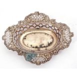 Early 20th Century silver bon-bon dish of shaped oval design, pierced and embossed decorated, hall