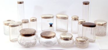 Mixed Lot: sixteen various glass and silver lidded dressing table jars, various dates and makers,