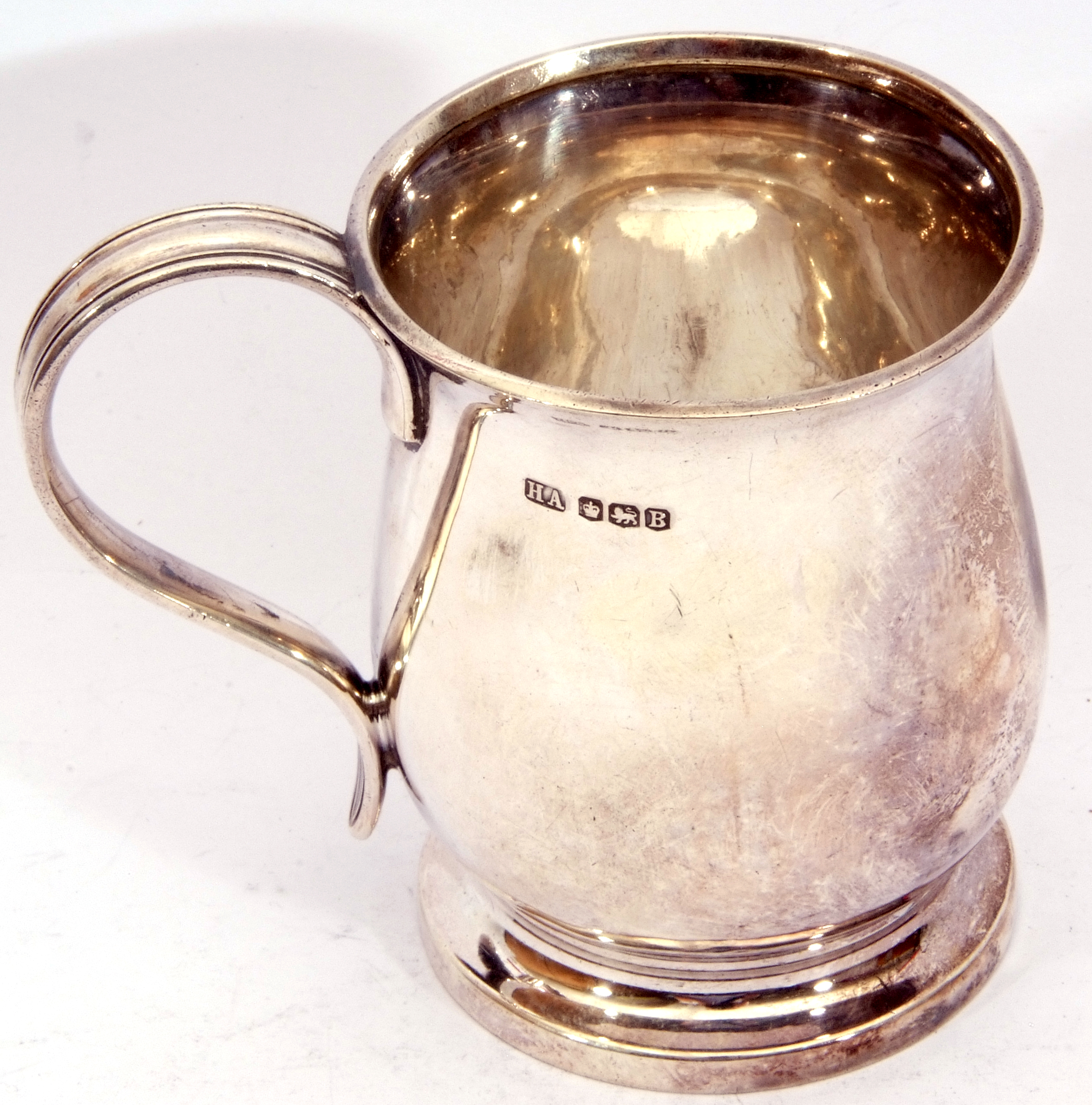 George VI silver mug of plain baluster shape, reeded handle to a raised spreading foot, 8 cm high, - Image 2 of 3