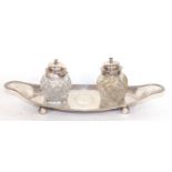 George III snuffer tray of boat shaped with beaded rim and double headed eagle crest to centre,