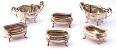 Mixed lot. Set of four oval open salts of rectangular form with card cut rims on four feet, hall