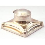 George V Silver square capstan inkwell, the hinged domed lid to the integral collar and base (