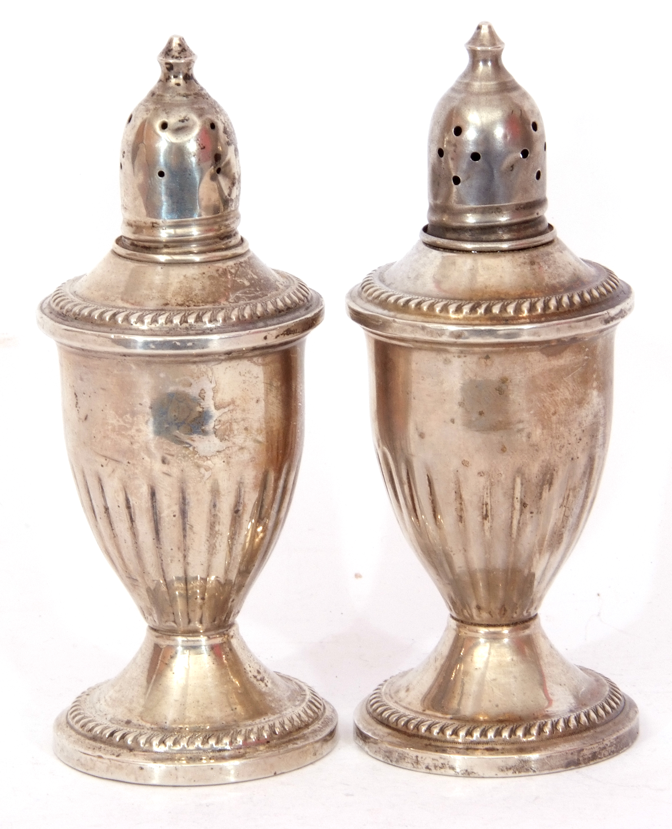 Pair of antique silver loaded peppers of vase form, pierced detachable tops, half fluted bodies, - Image 2 of 2