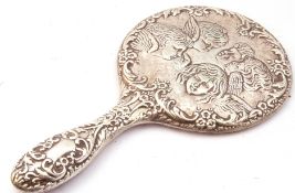 Silver backed hand mirror decorated with cherubs, scrolls etc, Birmingham 1987 (a/f)