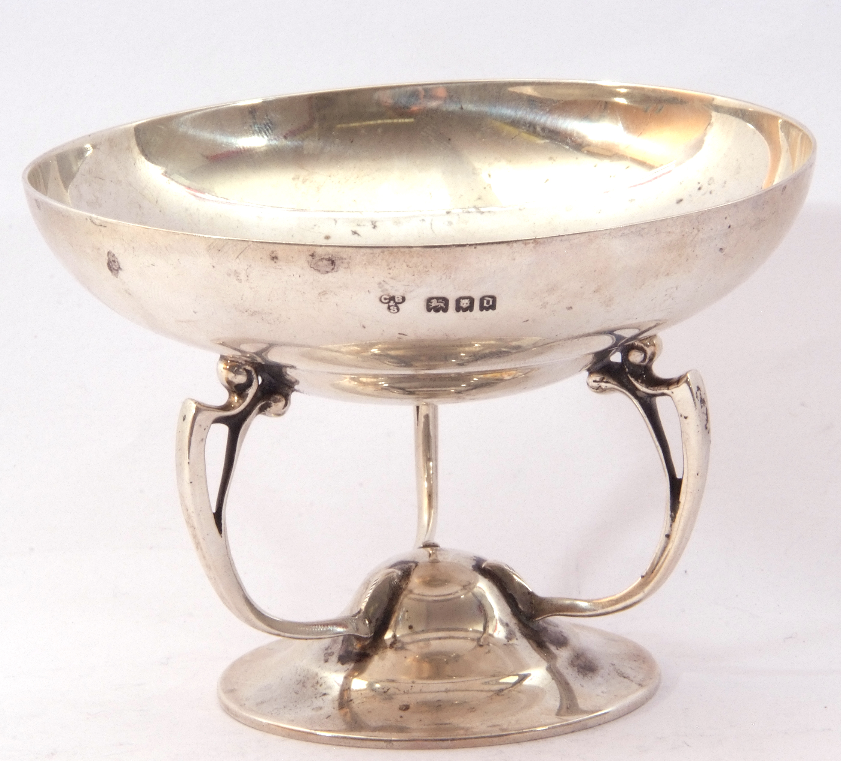 George V silver bon-bon dish, the circular shallow dish supported on three art nouveau style handles