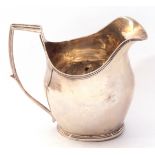 George III silver helmet cream jug, bellied shaped with reeded square topped handle and rims, hall