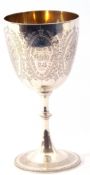 Victorian silver goblet engraved with floral entwined cartouches and having a presentation engraving