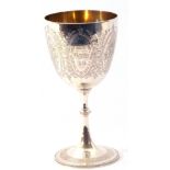 Victorian silver goblet engraved with floral entwined cartouches and having a presentation engraving