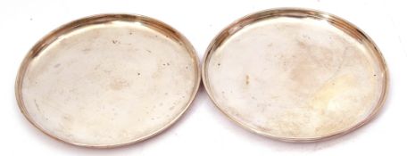 Pair of hall marked silver small trays of plain circular form, hall marks rubbed, makers mark