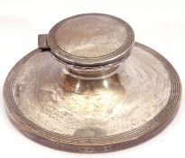 Silver capstan inkwell of typical form, the hinged lid and base with reeded borders to edges, no