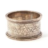 Cased late Victorian Silver Serviette Ring chased and engraved with a geometric design and a