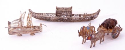 Mixed Lot: white metal filigree miniature gondola boat, a 925 stamped yacht, together with a