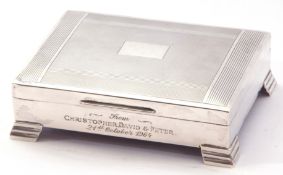 Silver table-top cigarette box, hinged lid with engine turned decoration, presentation engraved