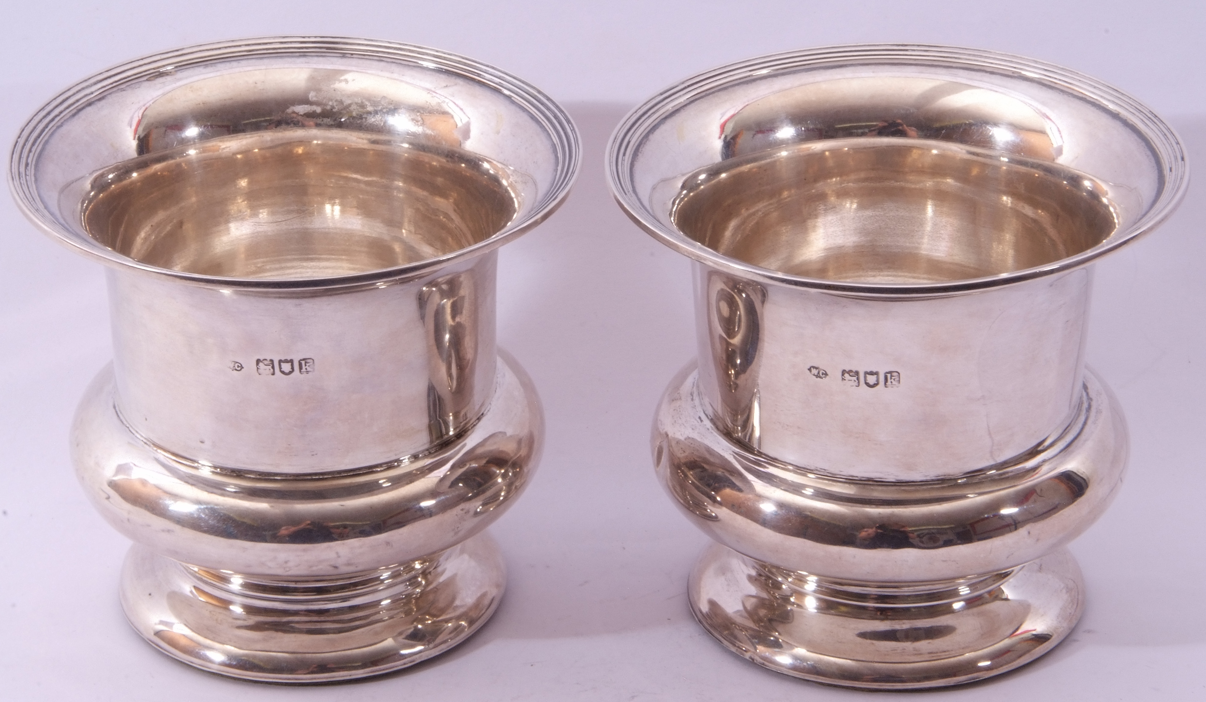 Pair of silver bottle holders of campana shape, plain polished form, reeded rims (loaded), hall - Image 3 of 3