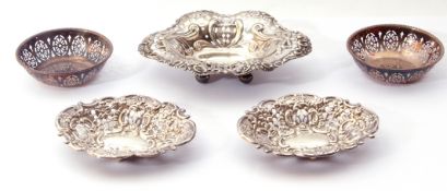 Mixed lot. Pair of Victorian silver bon bon dishes of oval form, pierced and embossed on four ball