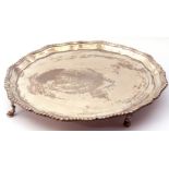 George VI salver of plain design, shaped circular form with gadrooned wavy edge supported on four