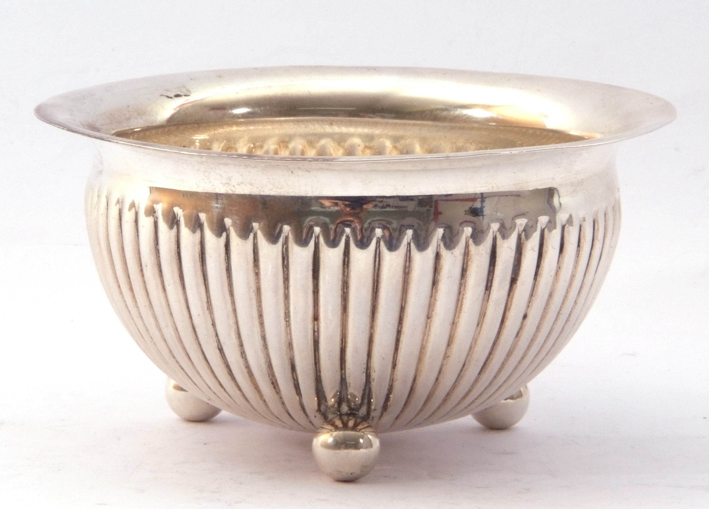 Victorian silver bowl of circular form with fluted body standing on three ball feet, hall marked