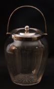 George V glass biscuit barrel of plain design with star cut base, having applied silver collar,