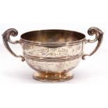 Edward VII silver twin handled pedestal Trophy Cup of circular squat form, having scroll handles