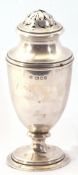 George V Silver caster of plain baluster form with pierced pull off dome lid on a spreading foot (