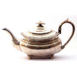 George IV tea pot of compressed rectangular design, having gadrooned rim, leaf capped spout and