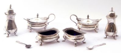 A six-piece silver condiment set comprising two hinged lidded mustards and liners, two open salts
