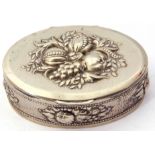Vintage metal oval tobacco box, the lid and sides decorated with fruit and leaves etc, 9.5 x 7cm