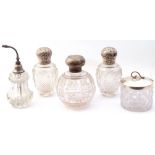 Mixed Lot: pair of Victorian cut glass scent bottles with embossed silver screw on lids, London 1889