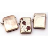 Mixed Lot: Continental white metal and enamel vesta, the front inlaid with red enamel flowers and